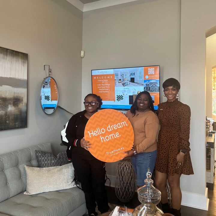 Holly McDonald celebrating in her new home with a ‘Hello dream home’ sign